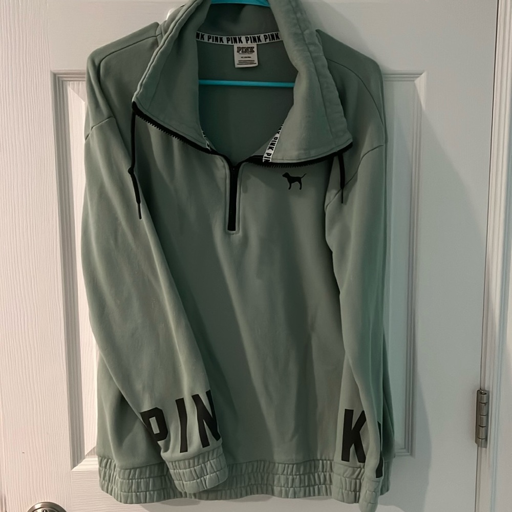 PINK 1/4 zip. Lightly worn.